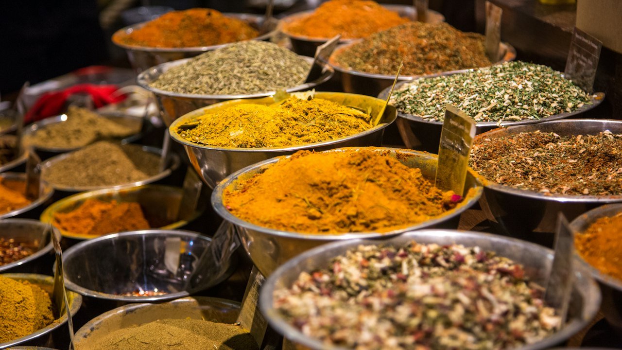 Bowls of spices and ingredients at a market