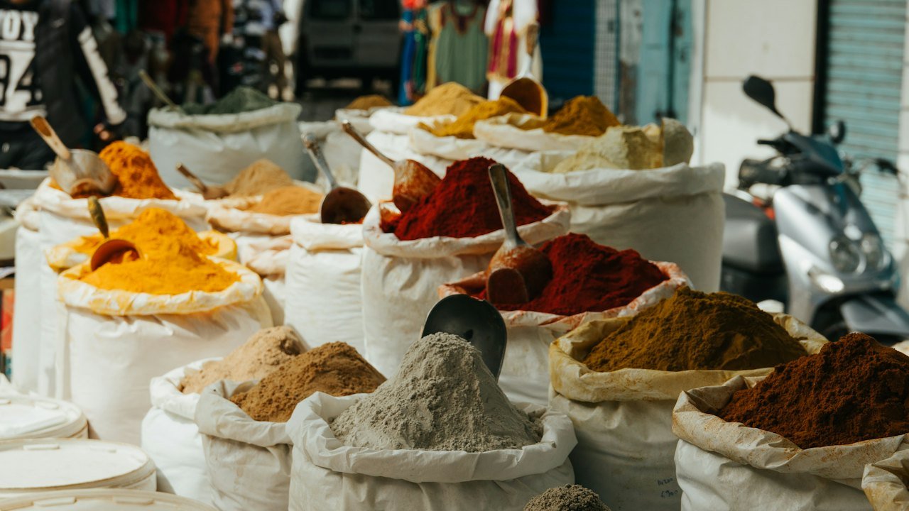 Sacks of ground spices at a market stall